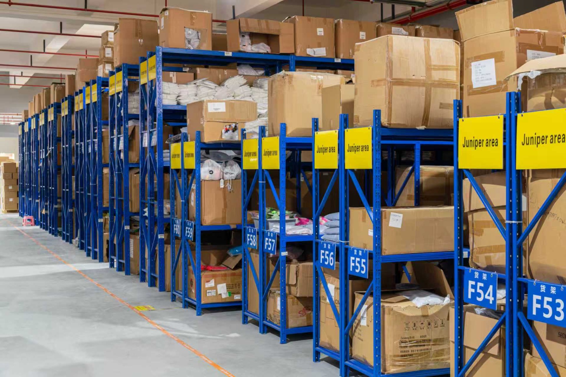 Warehouse racks with organized product cartons
